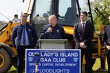 thumbnail: On Thursday morning in Our Lady's Island GAA at the sod turning for astro turf flood lighting and  hurling wall were pupils  from Scoil Mhuire Broadway who cheered on as Sean Pettit, Minister James Browne TD and Minister Jack Chambers  TD turned the sod.Micheál Martin Chairman of Wexford GAA speaking