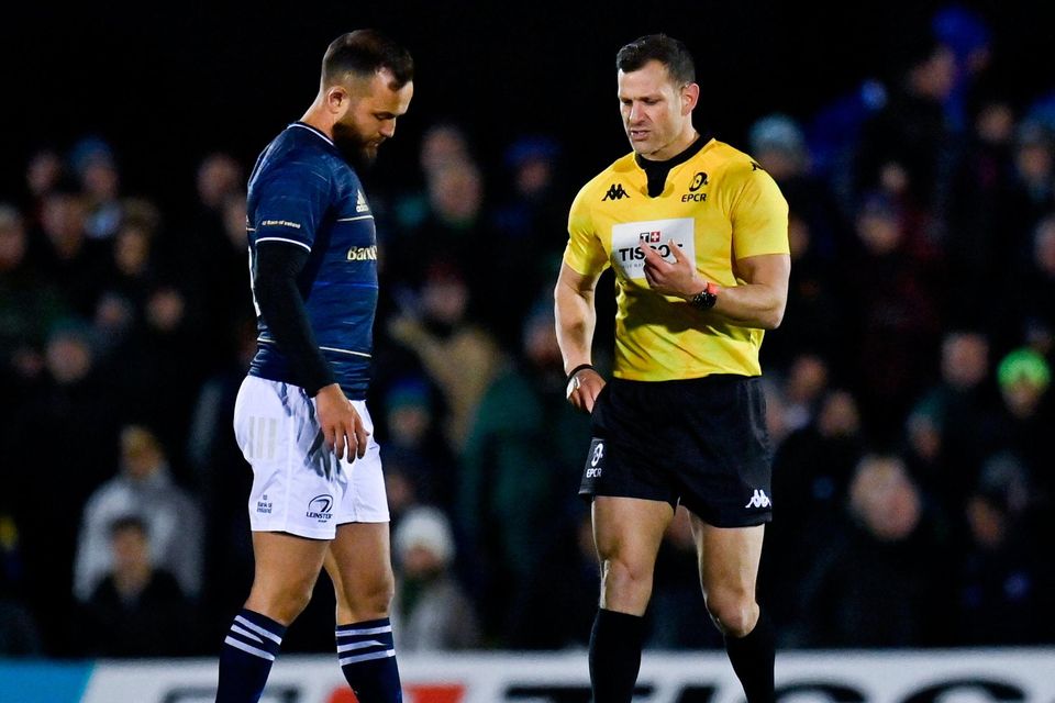 Jamison Gibson-Park of Leinster speaks with referee Karl Dickson before receiving a yellow card during the Heineken Champions Cup round of 16 first leg at the Sportsground in Galway. Photo: Harry Murphy/Sportsfile