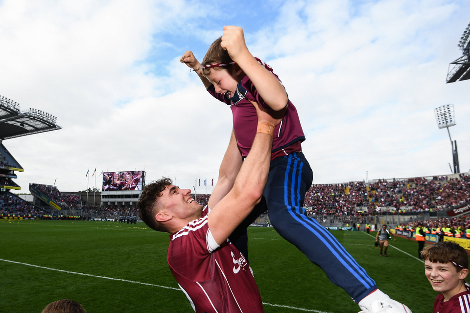 Jason Flynn of Galway celebrates with Jody Canning, nephew of Joe Canning, following the GAA Hurling All-Ireland Senior Championship Final match between Galway and Waterford at Croke Park in Dublin. Photo by Stephen McCarthy/Sportsfile