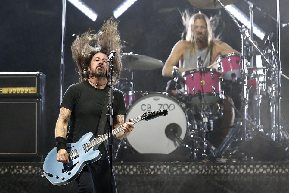 Fallen comrade: Dave Grohl and the late Taylor Hawkins (right) in action for Foo Fighters in March last year. Photo by Marcelo Hernandez/Getty Images