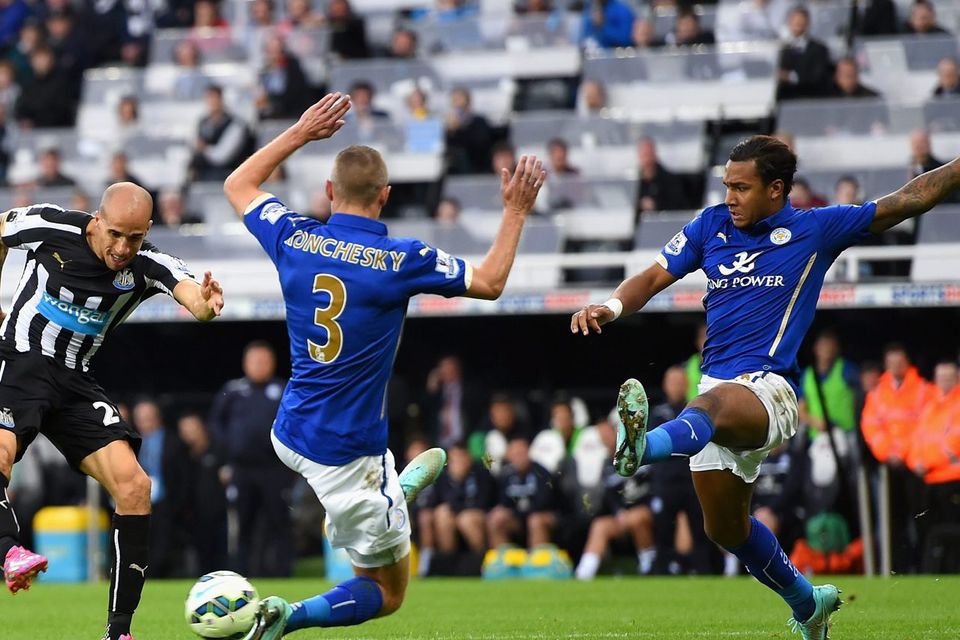 Newcastle player Gabriel Obertan (l) scores the opening goal during the Barclays Premier League match between Newcastle United and Leicester City