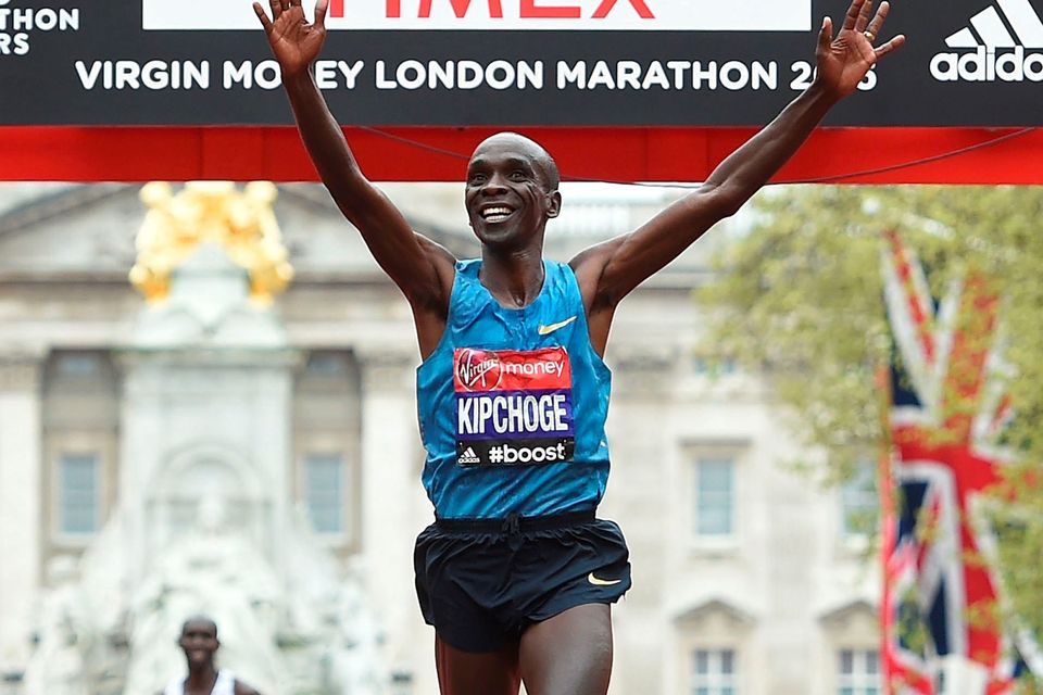 Eliud Kipchoge of Kenya celebrates after winning the Men's race during the Virgin Money London Marathon