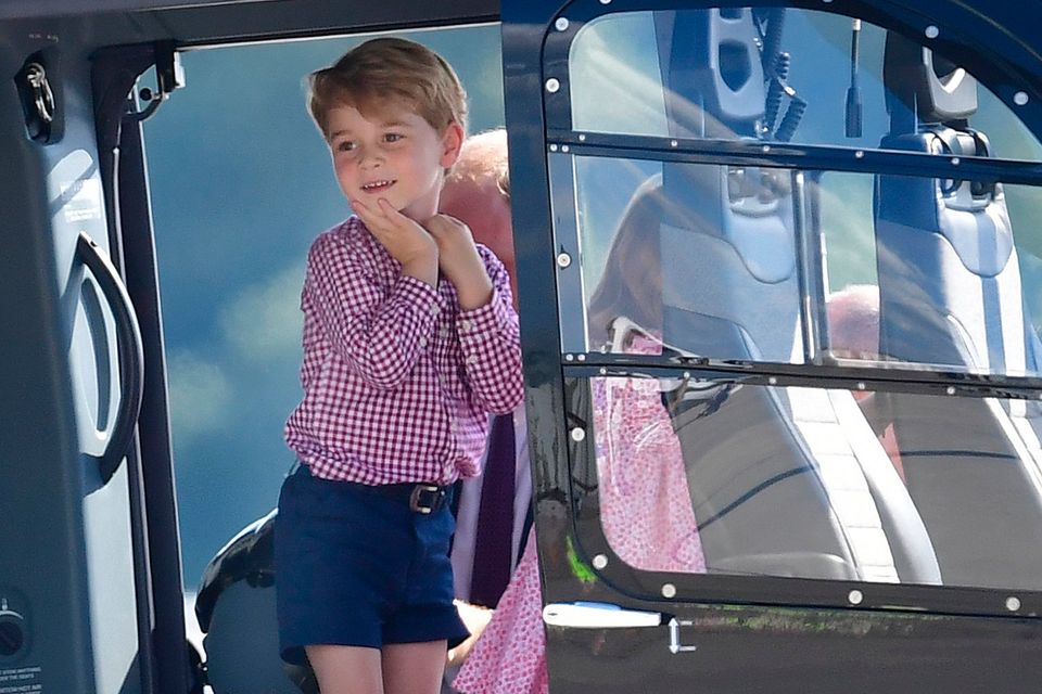 Prince George stands in a rescue helicopter, during a visit to Airbus in Hamburg, Germany with his parents the Duke and Duchess of Cambridge and his sister Princess Charlotte. Photo credit : Dominic Lipinski/PA Wire
