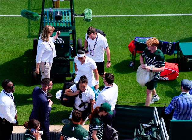 Tearful Ons Jabeur retires from Wimbledon match due to breathing difficulties while Emma Raducanu marches on