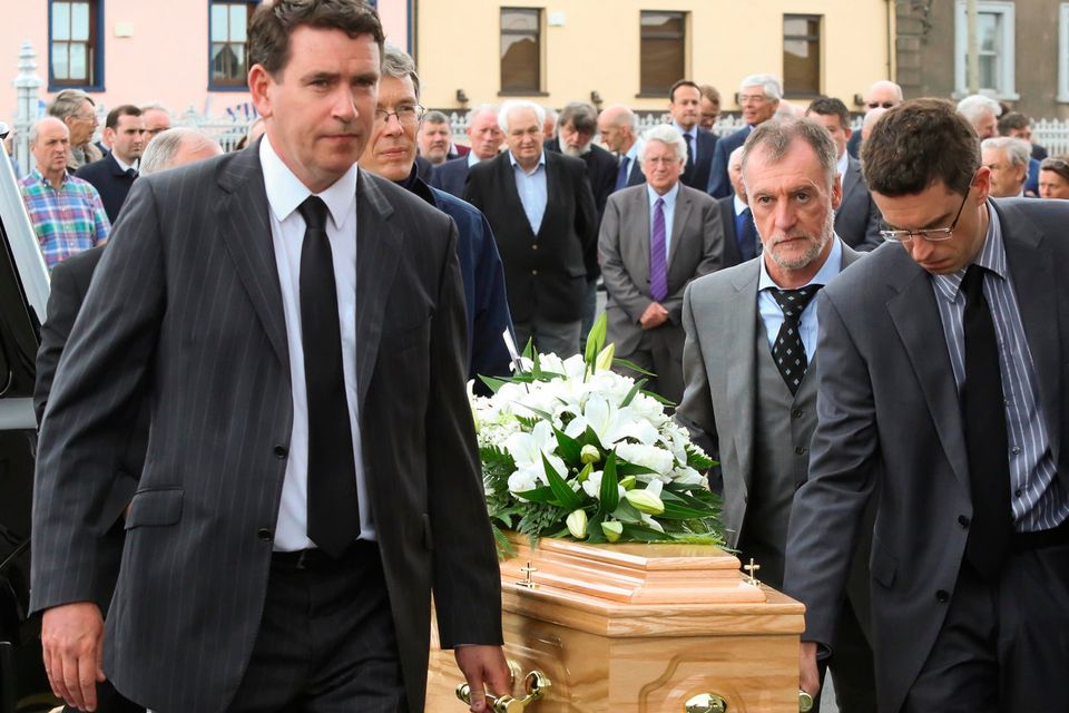 Funeral of Austin Deacy at St.Mary’s parish church Dungarvan. John Deacy TD and his brother Jamie lead their father’s coffin into the church.Photo;Mary Browne