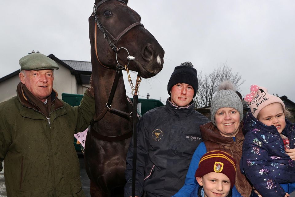 Trainer Willie Mullen with groom Adam Connolly, and Maria Lawler with her children James (6) and Mia (4) at Leighlinbridge Co Carlow for the homecoming of Galopin Des Champs. Photo: Steve Humphreys