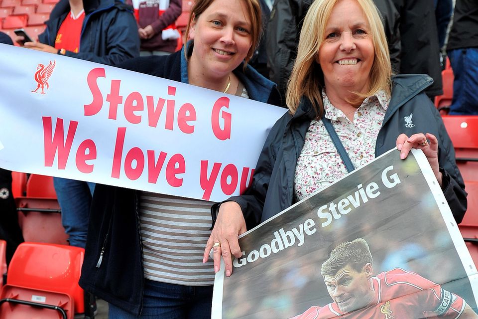 Two Liverpool fans with a message for Steven Gerrard during the Barclays Premier League match at the Britannia Stadium, Stoke. 
Dave Howarth/PA Wire.