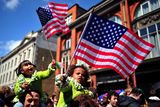 thumbnail: Children wave US flags as they queue to see President Obama. Photo: Getty Images