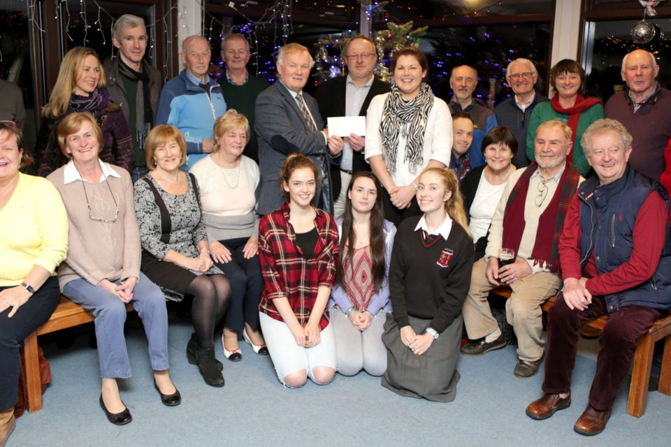 The Bray Sailing Club Choir present a cheque to Sa Bhaile Charity: John Byrne and Nicola Jones accepts the cheque from Commodore Mark Henderson