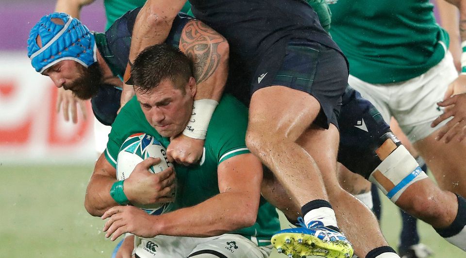 Ireland player CJ Stander is tackled by Blade Thomson (l) and Allan Dell. Photo by Stu Forster/Getty Images
