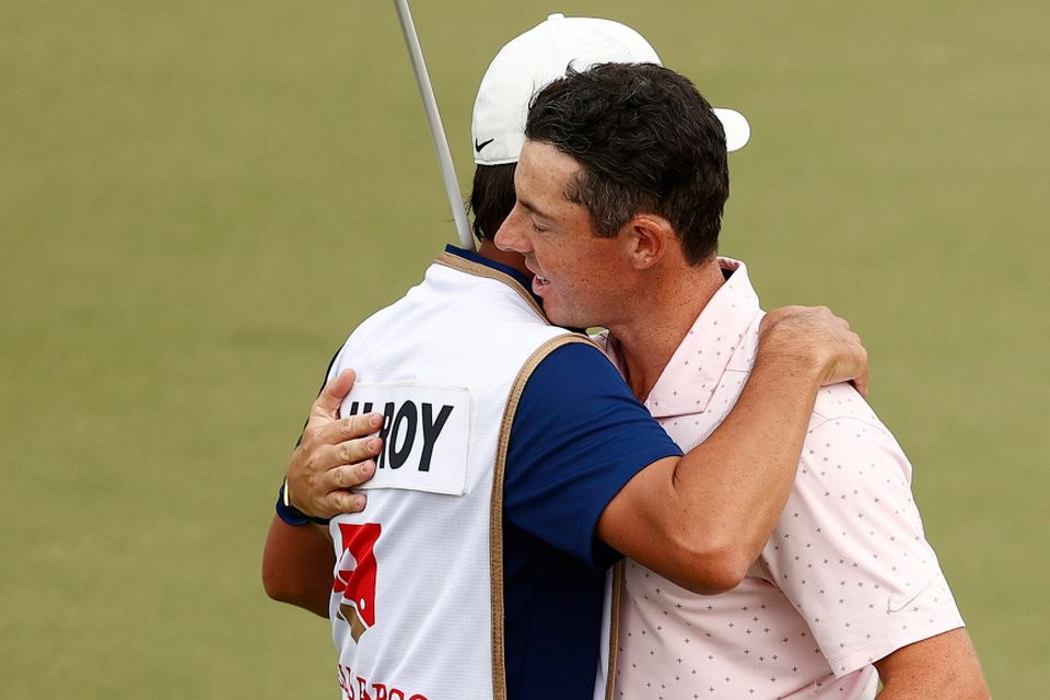 Rory McIlroy celebrates with caddie Harry Diamond after winning on the 18th green during the final round of the 2021 Wells Fargo Championship at Quail Hollow Club