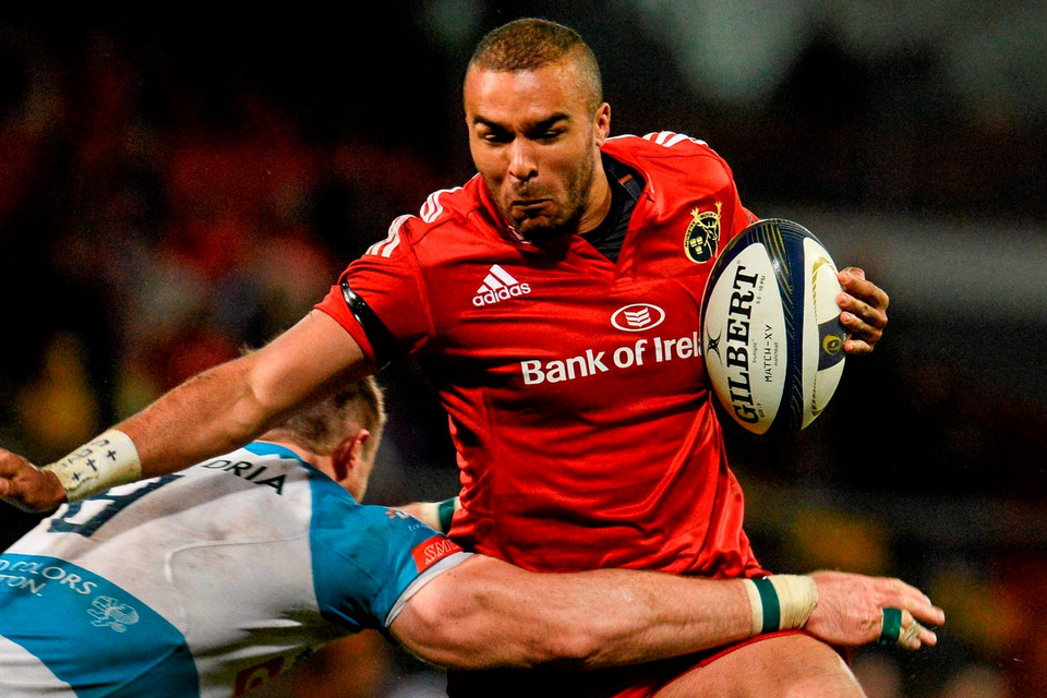 Simon Zebo, Munster, is tackled by Marco Barbini, Benetton Treviso