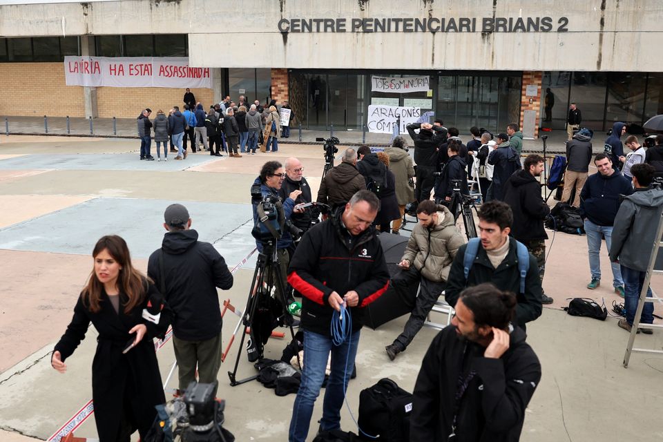 Members of the media wait outside Brians 2 prison where Brazilian soccer player Dani Alves is due to leave on bail while he appeals his rape conviction