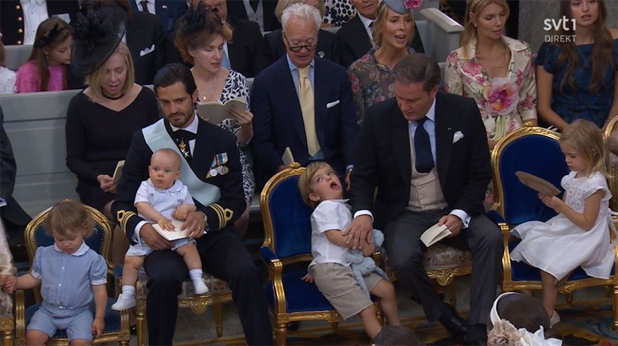 Sweden's Princess Madeleine, left holding Prince Nicolas stands next to her  husband Christopher O'Neill holding their daughter Princess Leonore, with  Queen Silvia and King Carl XVI Gustaf at right, during the christening