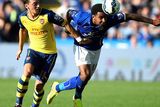 thumbnail: Arsenal's Mesut Ozil (L) fights for the ball with Leicester City's Liam Moore