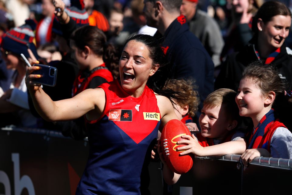 Sinéad Goldrick of the Demons celebrates with fans during the 2022 S7 AFLW Second Preliminary Final win over North Melbourne Kangaroos at Ikon Park in Melbourne, Australia.