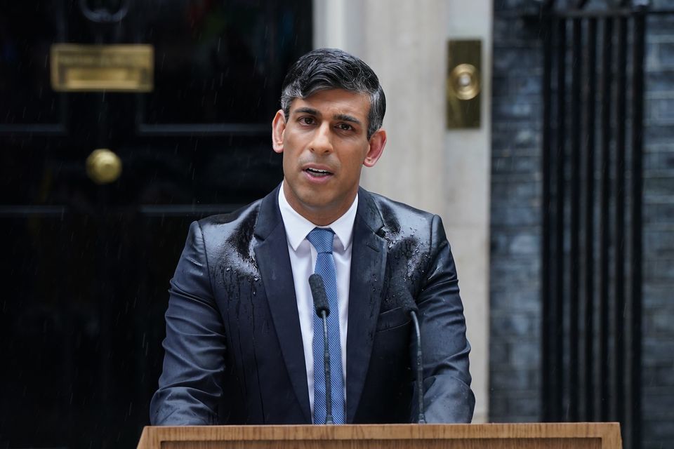 Prime Minister Rishi Sunak was soaked while making a speech outside No 10 (Lucy North/PA)