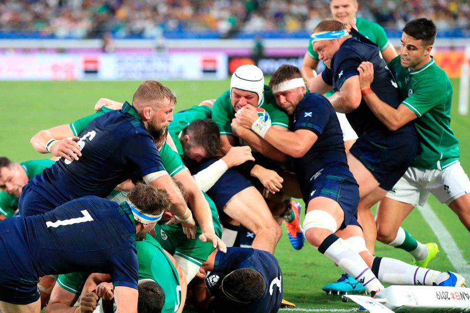 Determination is written across Rory Best’s face as the Ireland captain is supported by Conor
Murray and Peter O’Mahony on his way to going over for his side’s second try against Scotland in their World Cup Pool A opener at the International Stadium Yokohama. Photo: Adam Davy/PA Wire