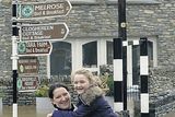 thumbnail: Emer and Niamh Finnegan wade through flooded streets in Kenmare on their way home