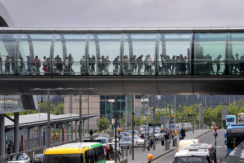 Passengers queue in the walkway into departures at Terminal 2 at Dublin Airport.Picture Credit:Frank McGrath.
