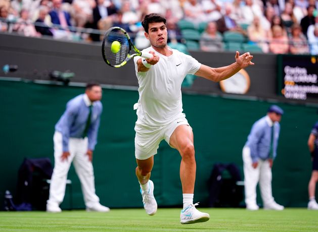 Carlos Alcaraz overcomes slow start to sail into Wimbledon third round