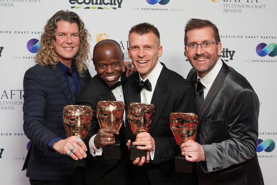 Tim Routledge, Kojo Samuel, Michael Sharp and Dan Shipton with the entertainment craft team award for the Eurovision Song Contest (Ian West/PA)