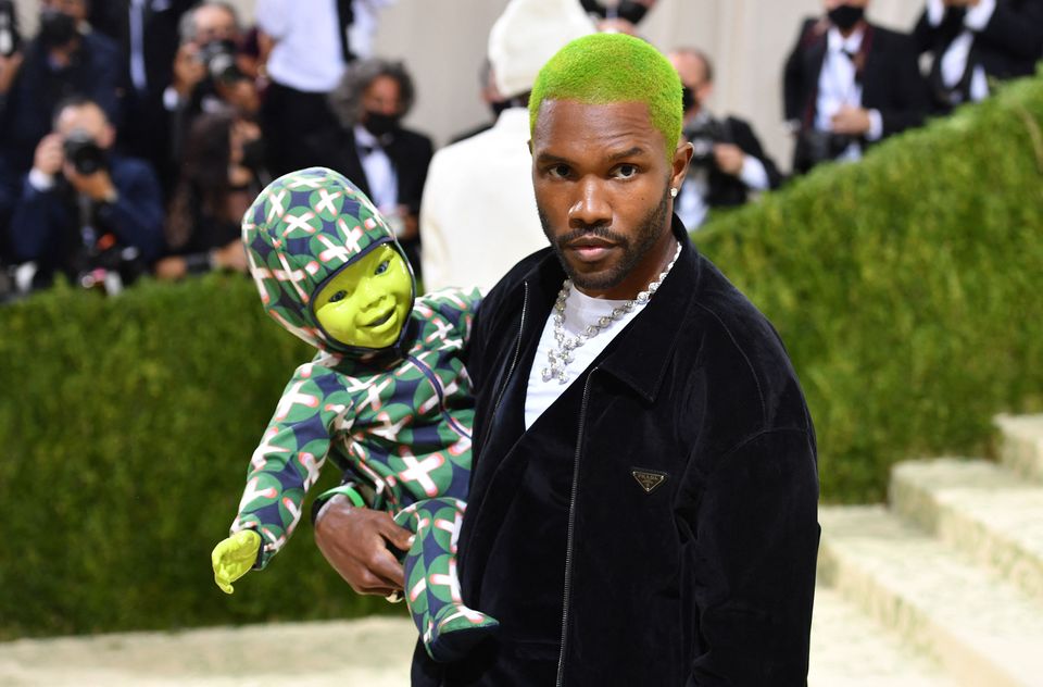 US singer-songwriter Frank Ocean holds a robot baby as hearrives for the 2021 Met Gala at the Metropolitan Museum of Art in New York. The 2021 theme was "In America: A Lexicon of Fashion." Photo by ANGELA WEISS / AFP