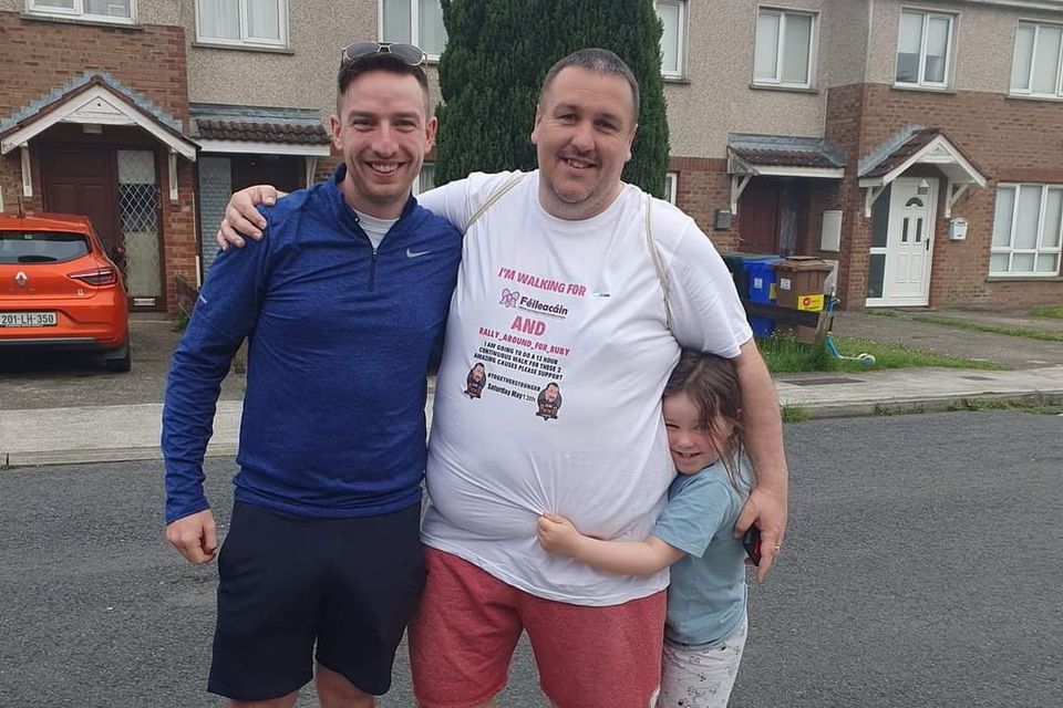 Kieran Pickering (centre) with his daughter Emma and Declan Murphy before setting off on his twelve hour walk around Dundalk