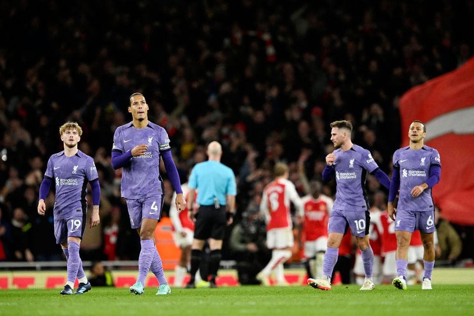 Liverpool's Harvey Elliott and Virgil van Dijk look dejected after Arsenal's Leandro Trossard scores their third goal