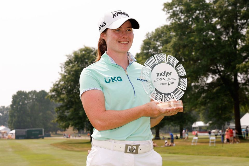 Leona Maguire poses with the Meijer LPGA Classic trophy at Blythefield Country Club in Grand Rapids, Michigan