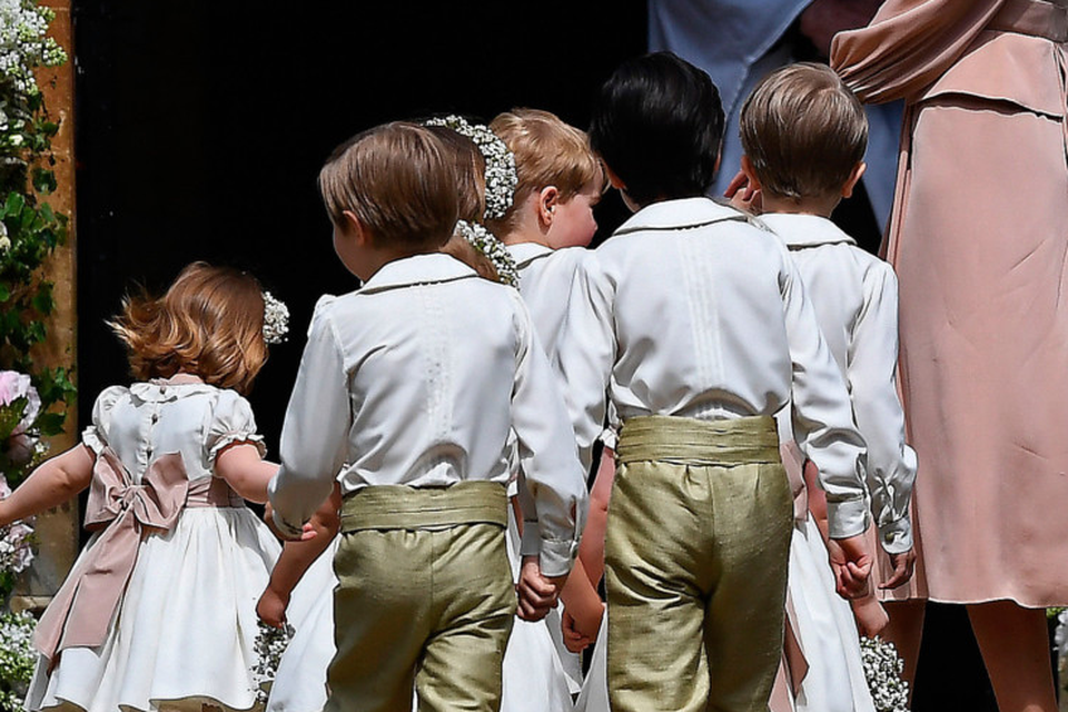 Hush little babies: Kate Middleton tries to keep the page boys and flower girls quiet as they enter the church for her sister Pippa’s big day. Photo: PA