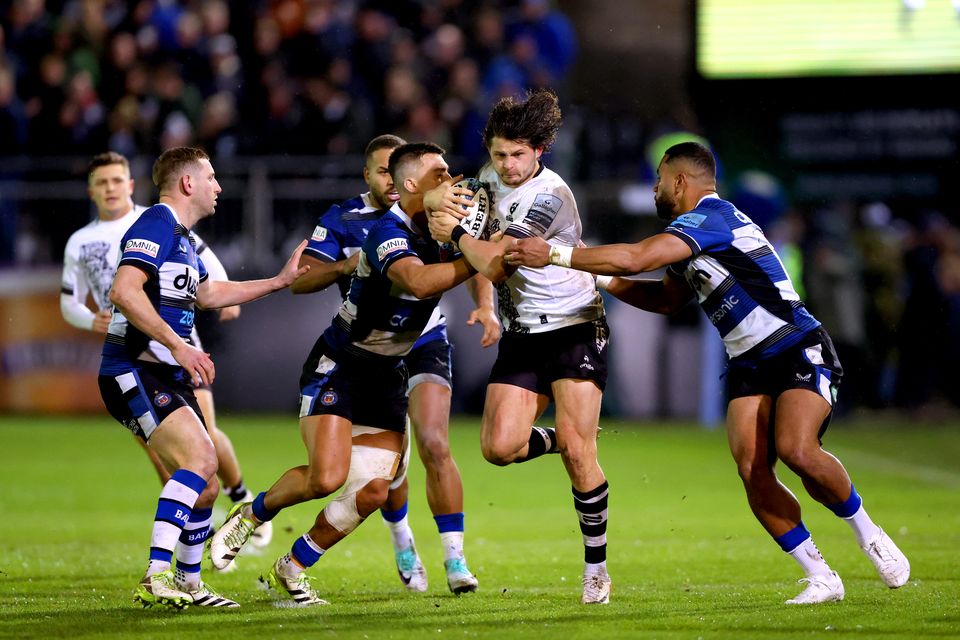 Bristol Bears' Piers O'Conor (centre right) is tackled by Bath Rugby's Joe Cokanasiga and Cameron Redpath. Picture: Nigel French/PA Wire