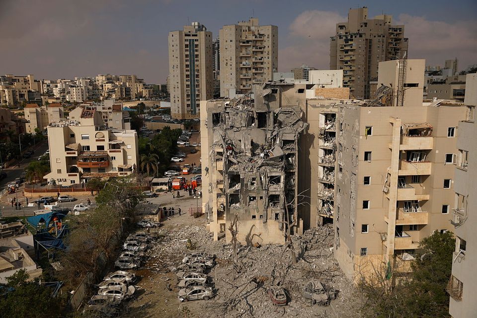 Emergency responders work at a building where at least four people died in a missile strike on June 24, 2025 in Beersheba, Israel. Photo by Amir Levy/Getty Images