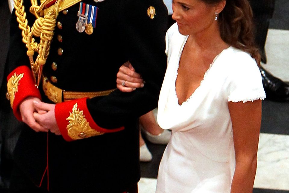 Prince Harry and Maid of Honour Pippa Middleton walk down the aisle at Westminster Abbey following the wedding ceremony of Prince William, Duke of Cambridge and Catherine, Duchess of Cambridge on April 29, 2011
