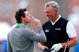 thumbnail: File photo dated 16-07-2014 of Northern Ireland's Rory McIlroy (left) celebrating winning a private bet with Northern Ireland's Darren Clarke during practice day four of the 2014 Open Championship at Royal Liverpool Golf Club, Hoylake