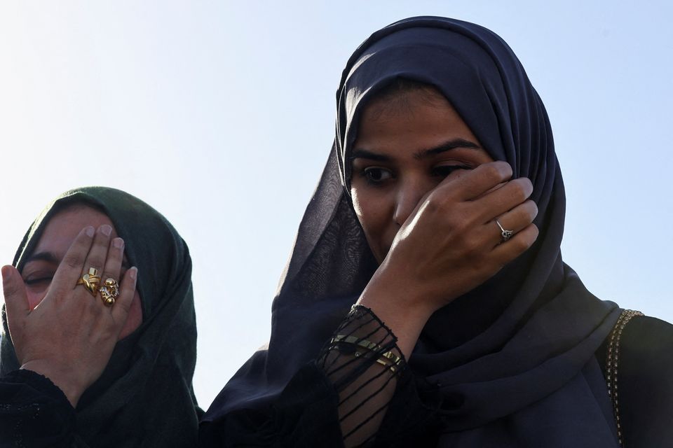 Yamama Hasani Alhussein cries with relief as she arrives at Abu Dhabi airport after being evacuated from Sudan. Photo: Rula Rouhana/Reuters