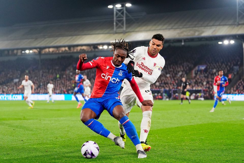 Crystal Palace's Eberechi Eze (left) and Manchester United's Casemiro battle for the ball during the Premier League match at Selhurst Park.