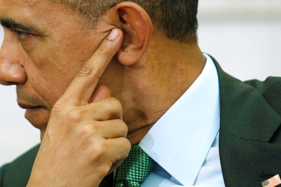 U.S. President Barack Obama listens during remarks by Ireland's Prime Minister Enda Kenny after their meeting in the Oval Office as part of a St. Patrick's Day visit at the White House in Washington March 17, 2015. REUTERS/Jonathan Ernst