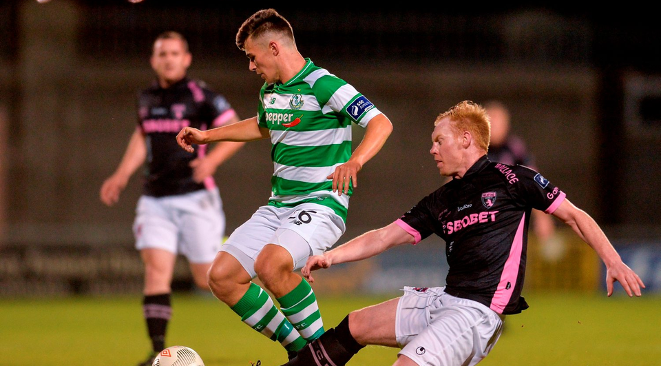 Aaron Dobbs of Shamrock Rovers in action against Stephen Last of Wexford Youths.  Photo: Eóin Noonan/Sportsfile