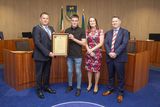 thumbnail: Cathaoirleach of the Wicklow Municipal District Paul O'Brien, CEO of Wicklow County Council Emer O'Gorman and Brian Gleeson present Adam Sinnott with the Cathaoirleach's Achievements and Contributions to Sport Award at a Civic Reception in Council Buildings, Wicklow town.