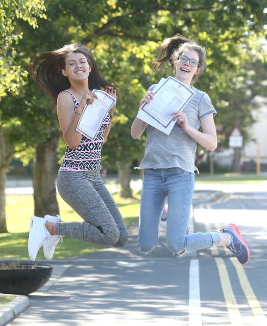 Shanuna Byrne, 19, left, and Sinead Power celebrate after recieving their Leaving certificate results at St Raphaelas Secondary School in Stillorgan. Picture credit; Damien Eagers 12/8/2015