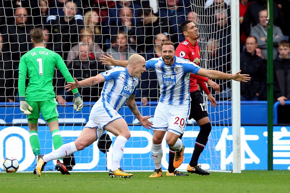 Huddersfield's Aaron Mooy celebrates scoring his side's first goal