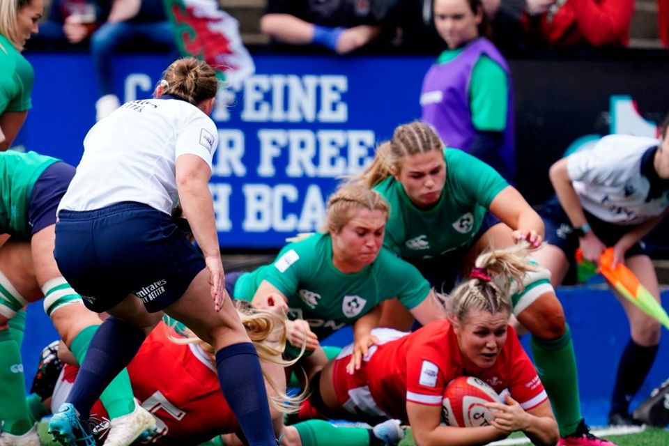 Wales' Alex Callender (right) scores the first try of the game