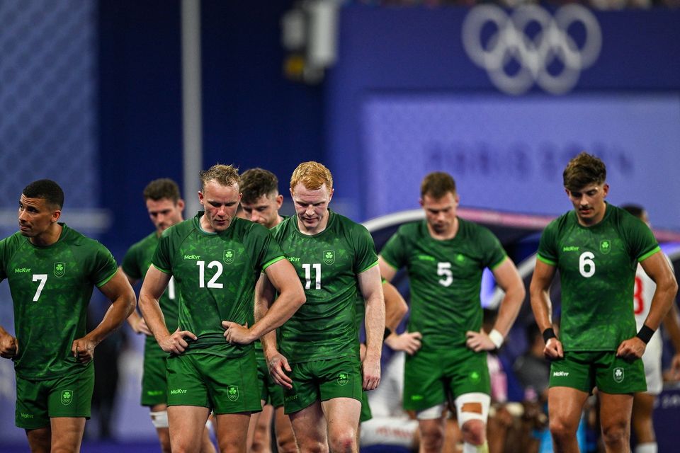 Team Ireland players, from left, Jordan Conroy, Niall Comerford, Gavin Mullin, Zac Ward and Chay Mullins after defeat in the Men's Rugby Sevens quarter-final match against Team Fiji at the Stade de France during the 2024 Paris Summer Olympic Games in Paris, France. Photo by Brendan Moran/Sportsfile