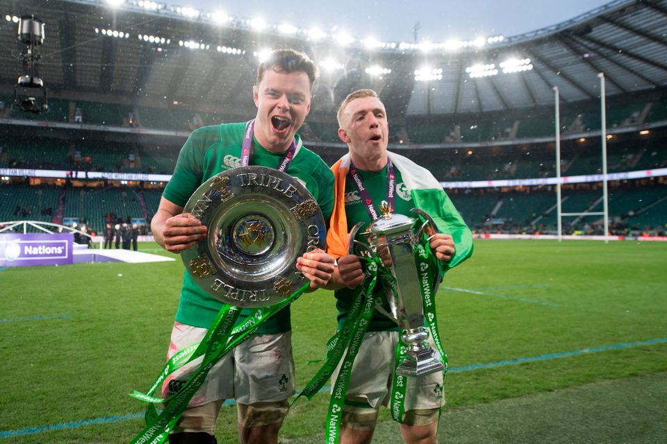 James Ryan, left, and Dan Leavy of Ireland with the Triple Crown and Six Nations Championship trophies
