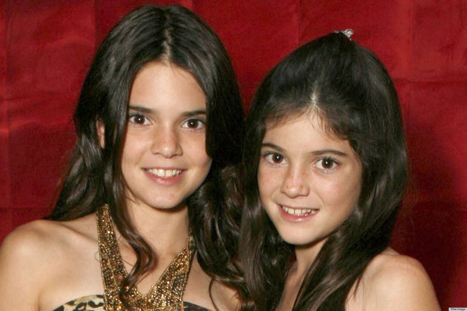 Kendall Jenner and Kylie Jenner pose for a photo at the "Keeping Up With the Kardashians" viewing party at Chapter 8 Restaurant on October 16, 2007