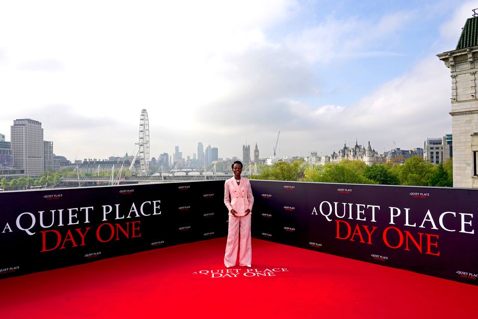 Lupita Nyong’o wore a baby pink suit (Ian West/PA)