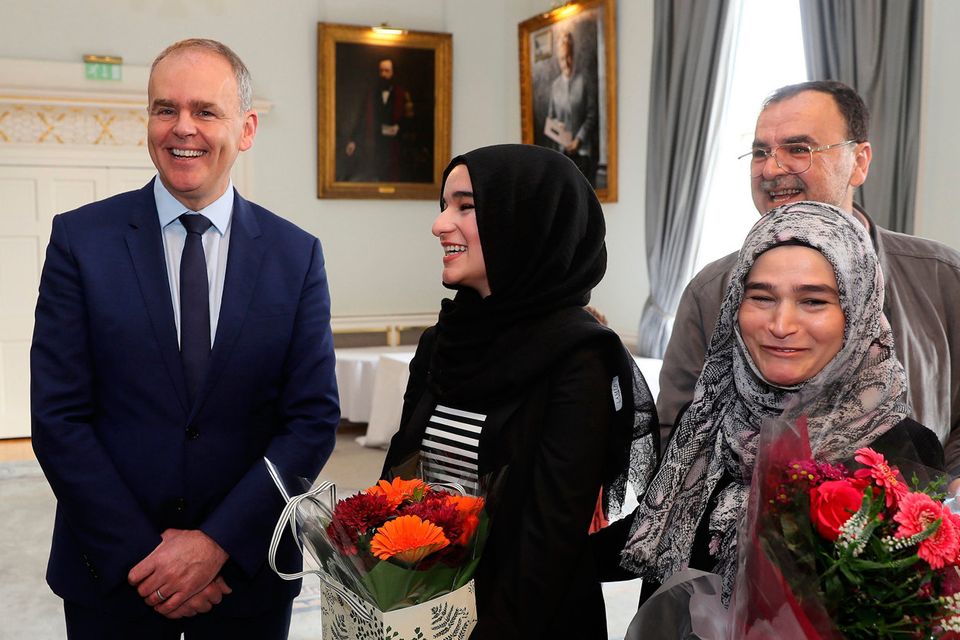 Top marks: Minister Joe McHugh (left) with Suaad Alshleh (second left) and parents Wesam Jouma and Issam Alshleh at the Royal College of Surgeons. Photo: PA
