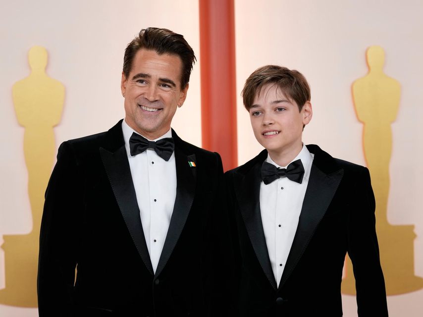 Colin Farrell and his son Henry Tadeusz arrive at the Oscars on Sunday, March 12, 2023, at the Dolby Theatre in Los Angeles. (AP Photo/Ashley Landis)
