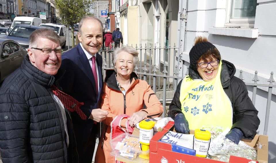 Cllr Ian Doyle, Miceal Martin with daffodil sellers Maura Doyle and Marie O'Brien at the AIB, Main Street, Charleville last Friday.